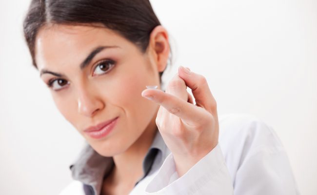 Female Optometrist With Contact Lens